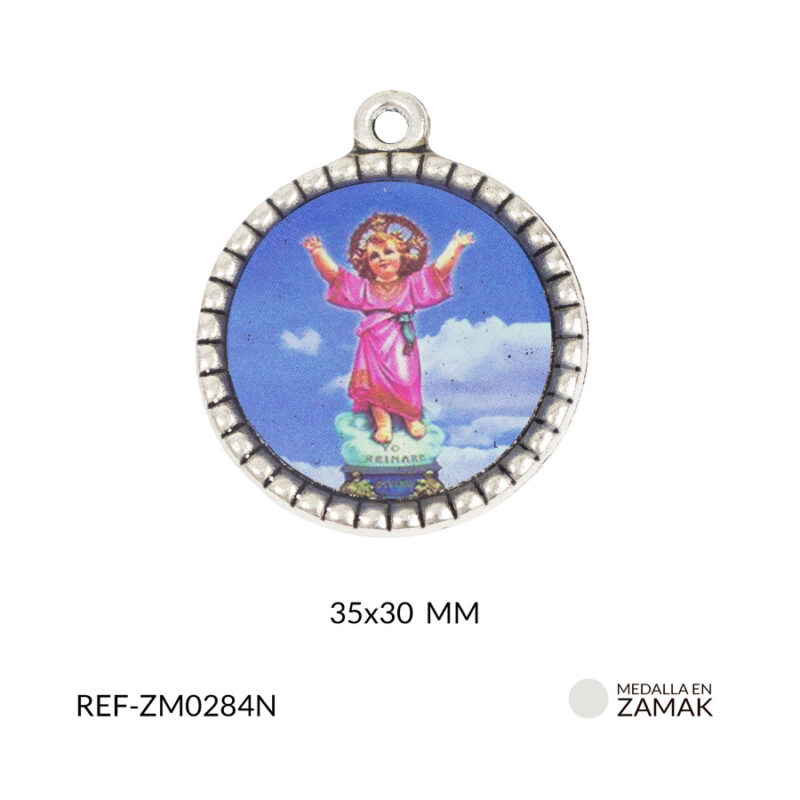 Medalla en zamak niquelada Divino niño 35x30 mm